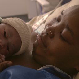 woman holds a newborn baby